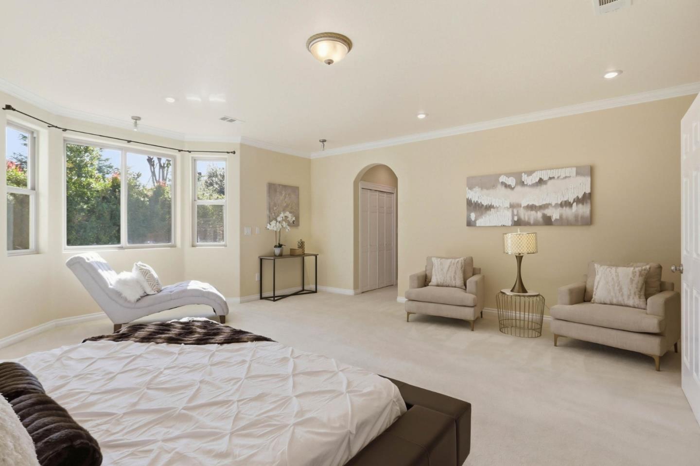 1352 South Stelling Road Cupertino, CA 95014 - Photo 24 of 49 a bedroom with furniture and large windows