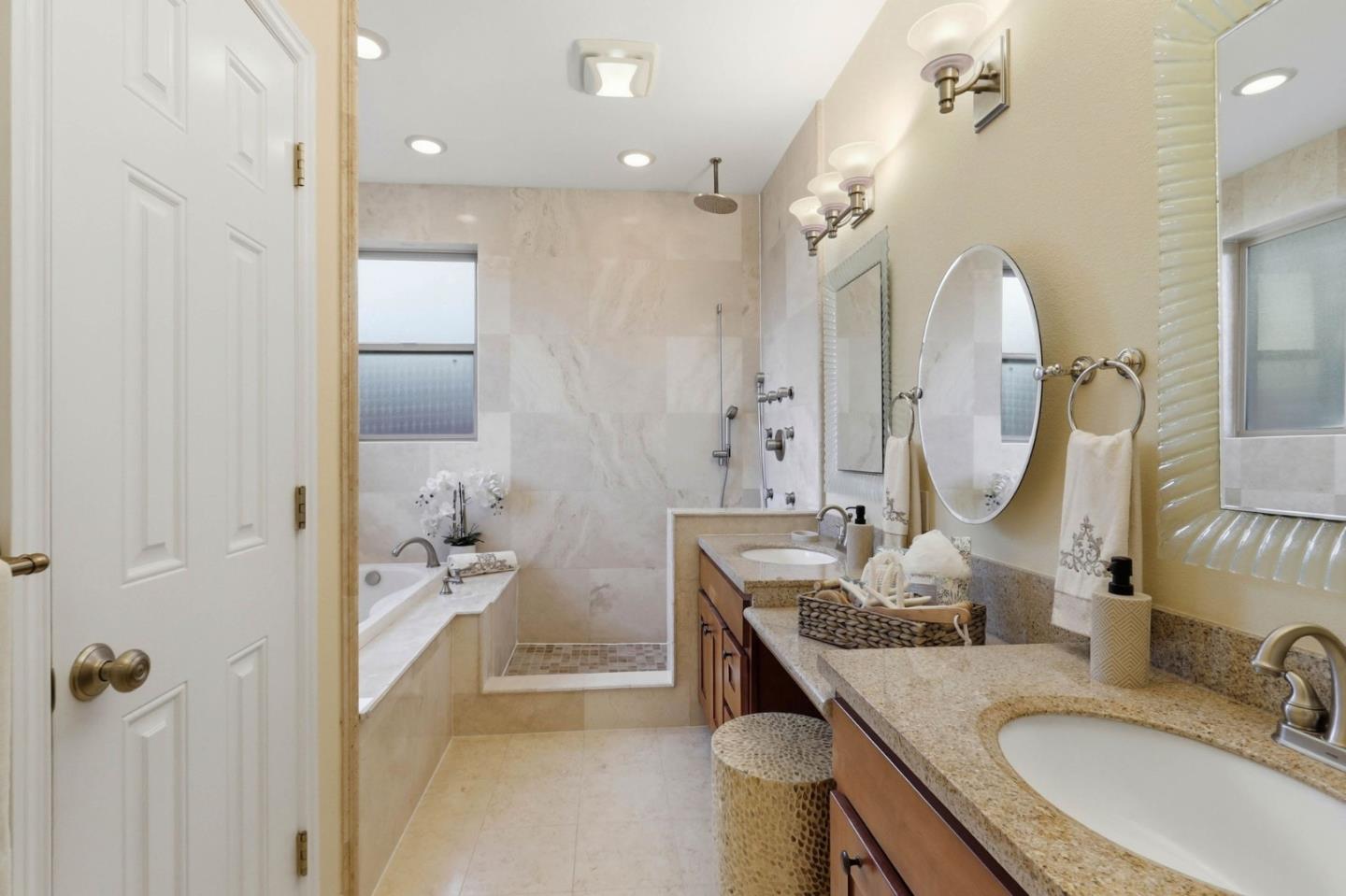 1352 South Stelling Road Cupertino, CA 95014 - Photo 28 of 49 a bathroom with a granite countertop sink a mirror and shower