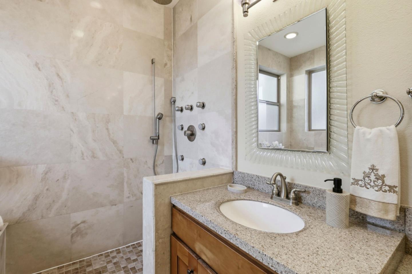 1352 South Stelling Road Cupertino, CA 95014 - Photo 29 of 49 a bathroom with a granite countertop sink toilet and shower