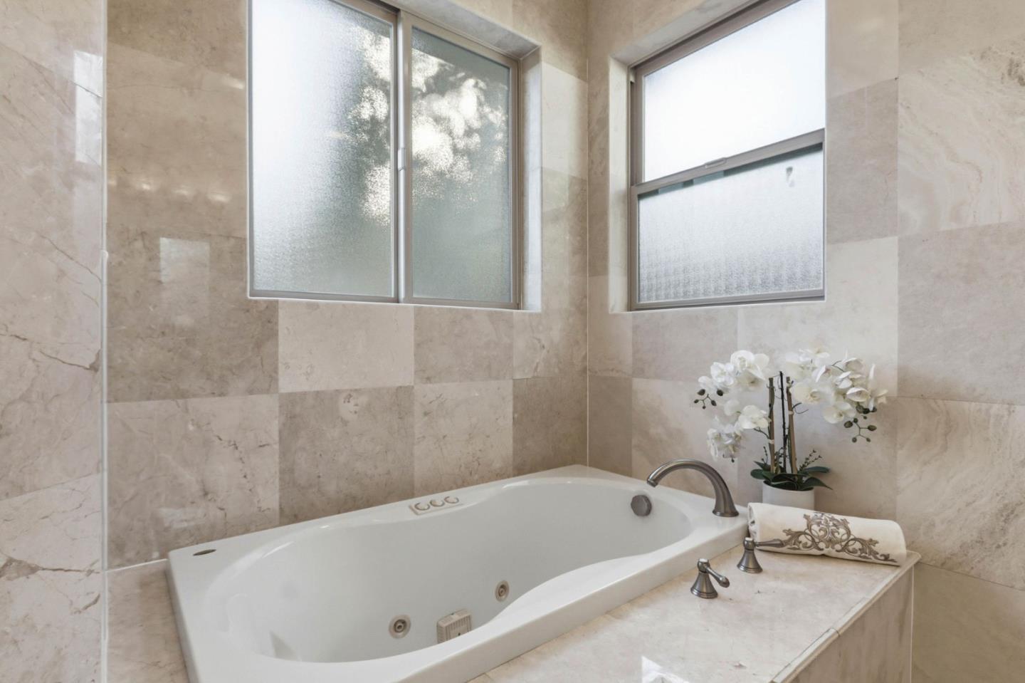 1352 South Stelling Road Cupertino, CA 95014 - Photo 31 of 49 a bathroom with a tub and a shower