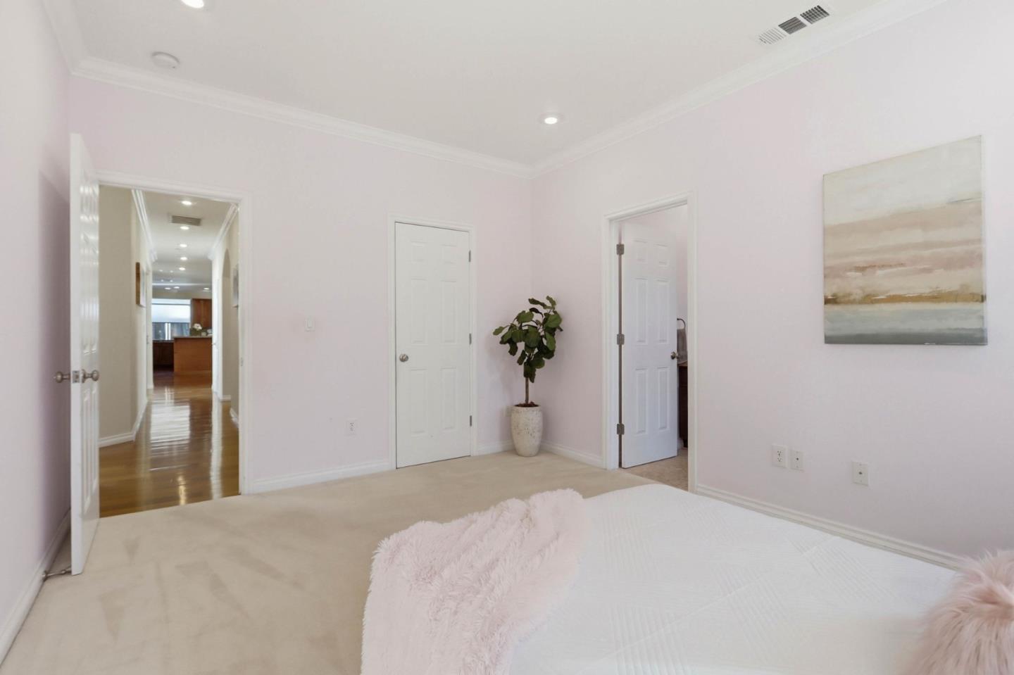 1352 South Stelling Road Cupertino, CA 95014 - Photo 33 of 49 a bedroom with a bed and a painting on the wall