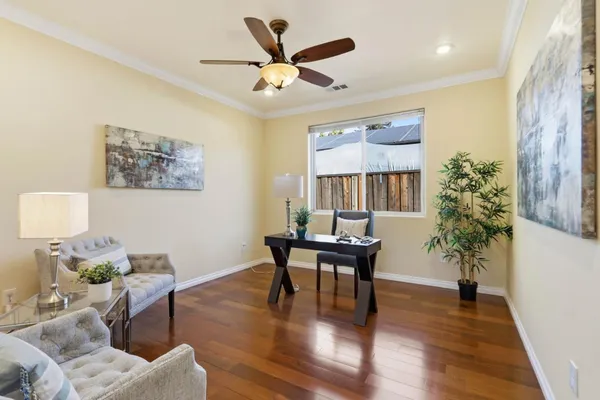 a workspace with furniture window and wooden floor