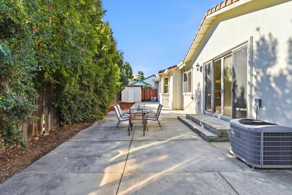 a patio with table and chairs