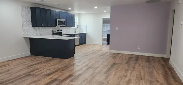 a view of kitchen with wooden floor