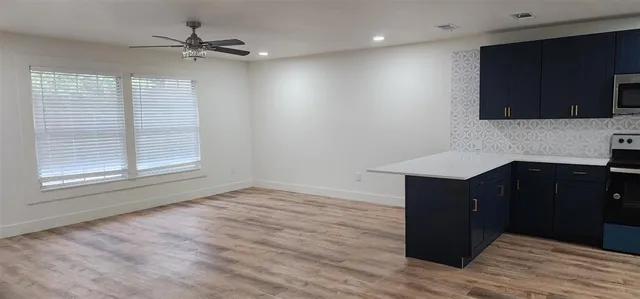 a kitchen with a sink and a microwave
