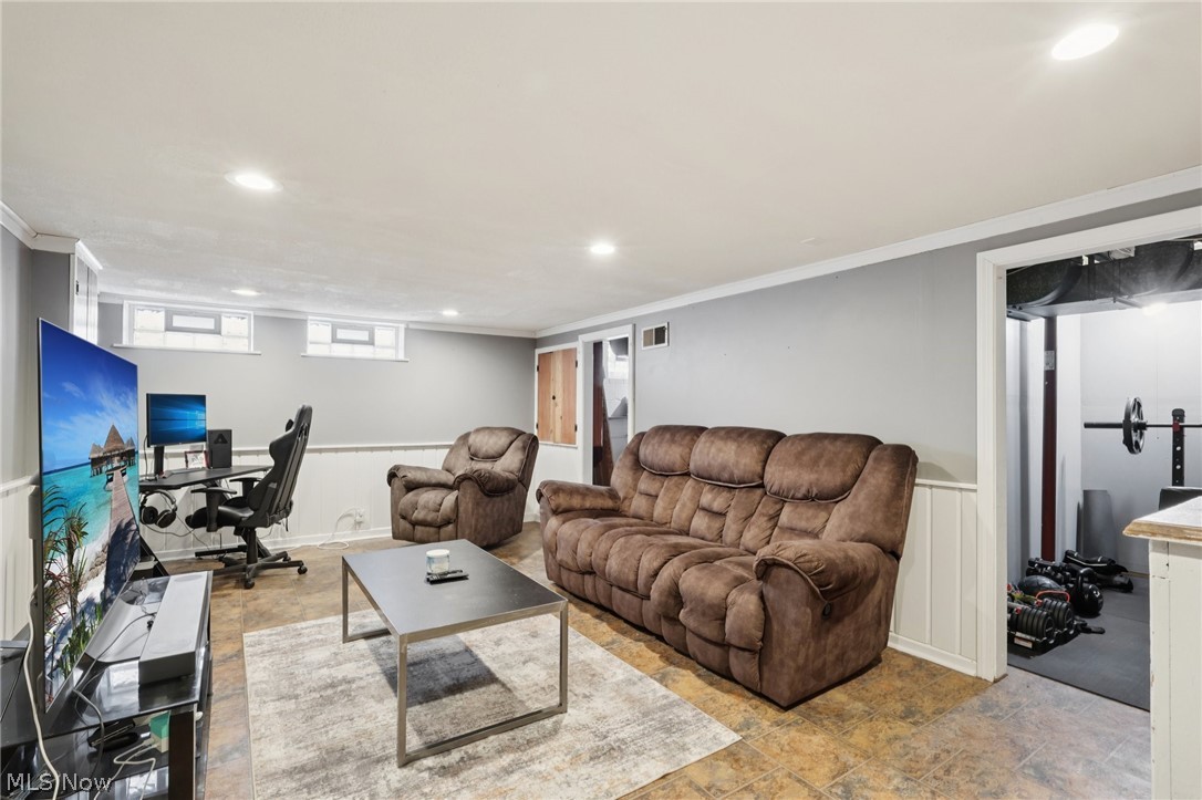 4784 Burger Road Cleveland, OH 44121 - Photo 21 of 27 Cute and cozy finished rec room with glass block