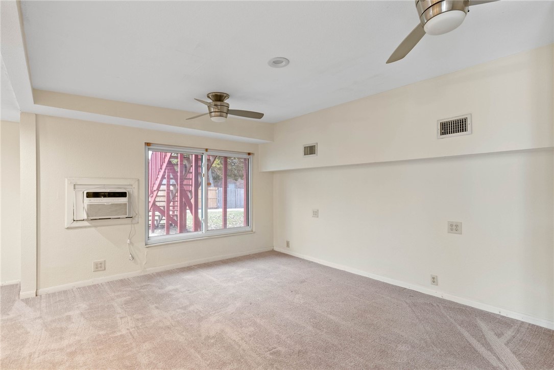 1225 Jonnell Street Corpus Christi, TX 78418 - Photo 14 of 39 an empty room with windows and cabinet