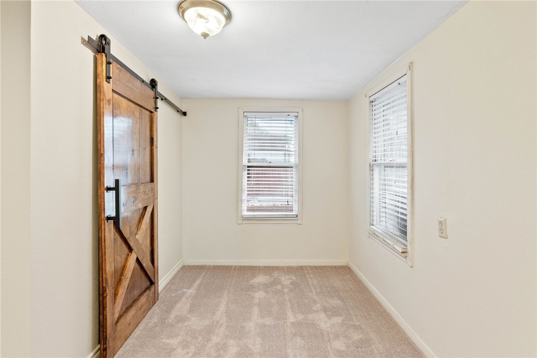 1225 Jonnell Street Corpus Christi, TX 78418 - Photo 16 of 39 a view of an empty room with stairs and a window
