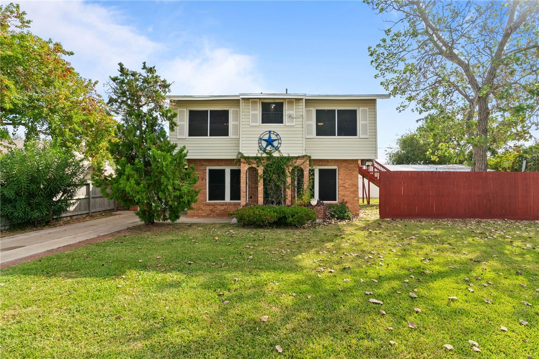 1225 Jonnell Street Corpus Christi, TX 78418 - Photo 2 of 39 front view of a house with a yard