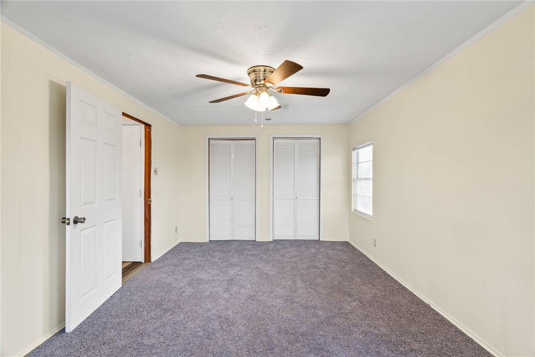 1225 Jonnell Street Corpus Christi, TX 78418 - Photo 22 of 39 a view of room with a ceiling fan and a window