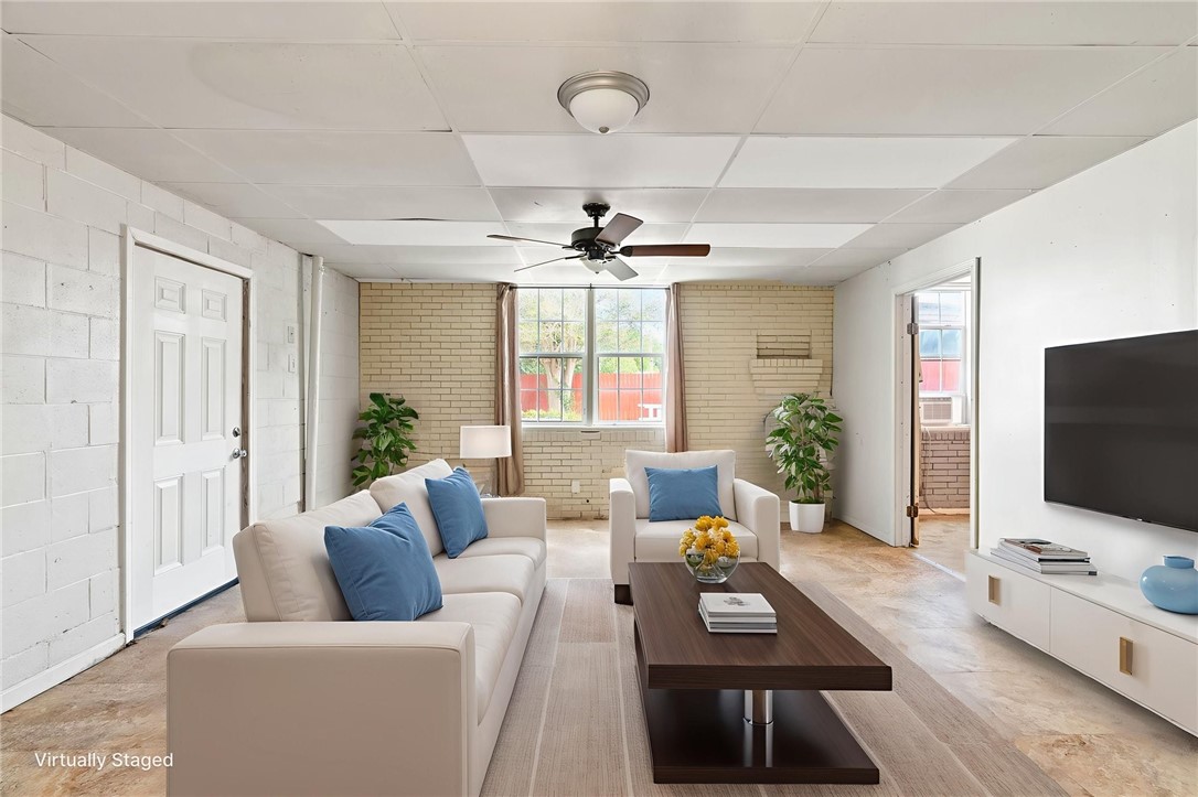 1225 Jonnell Street Corpus Christi, TX 78418 - Photo 26 of 39 a living room with furniture and a flat screen tv