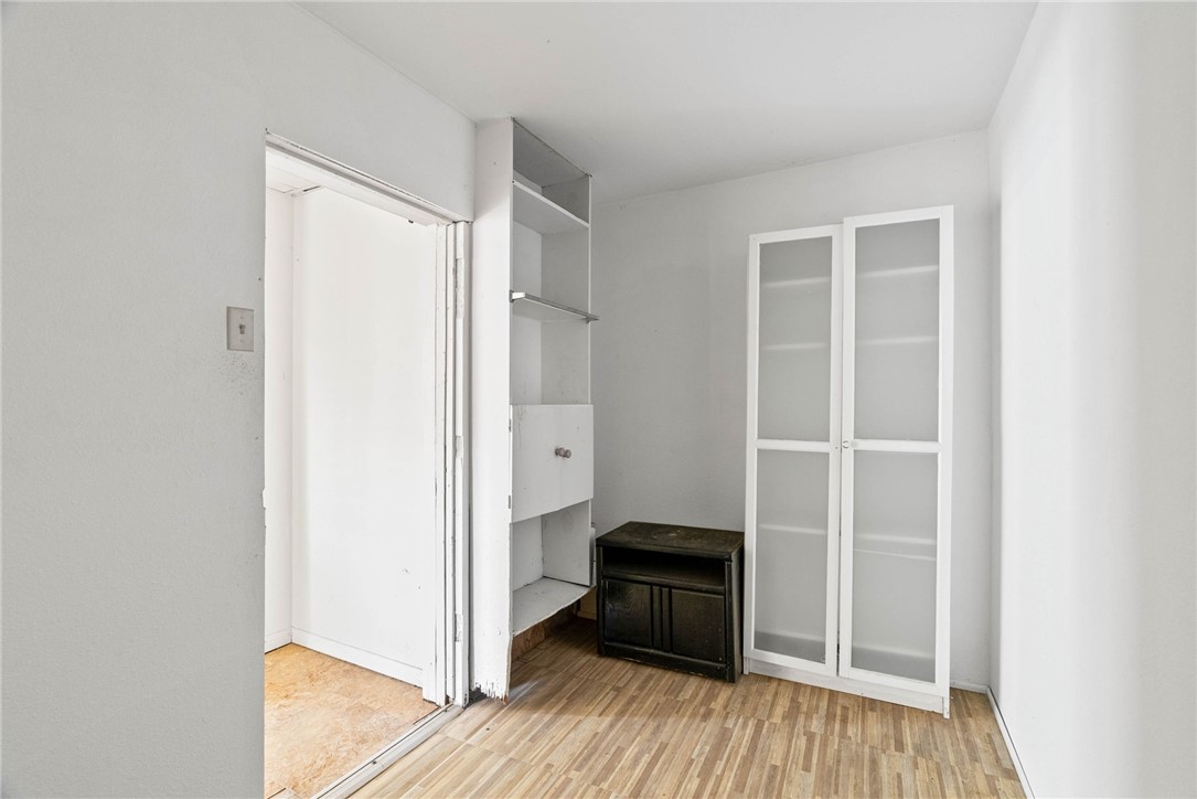 1225 Jonnell Street Corpus Christi, TX 78418 - Photo 31 of 39 a view of walk in closet with wooden floor