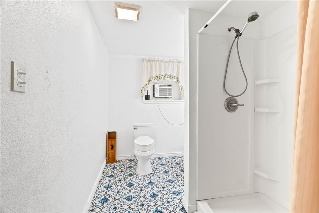 1225 Jonnell Street Corpus Christi, TX 78418 - Photo 32 of 39 a bathroom with a toilet and shower