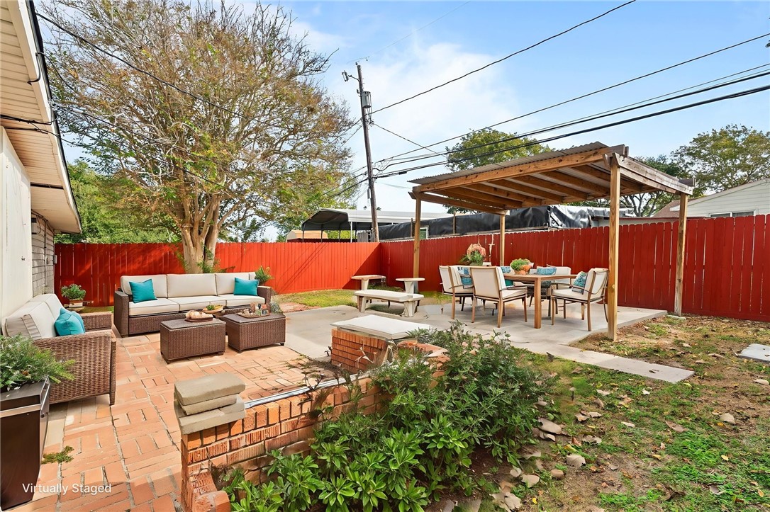 1225 Jonnell Street Corpus Christi, TX 78418 - Photo 35 of 39 a view of backyard with sitting area