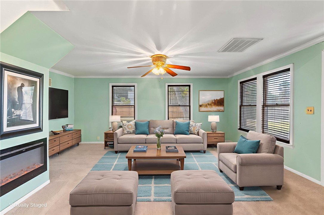 1225 Jonnell Street Corpus Christi, TX 78418 - Photo 5 of 39 a living room with furniture and a large window