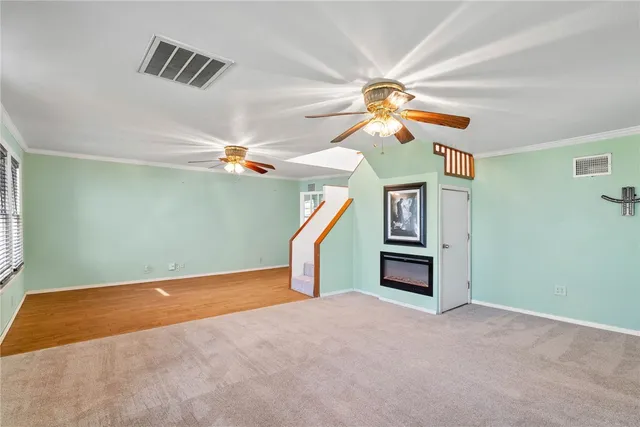 a view of a livingroom with a ceiling fan