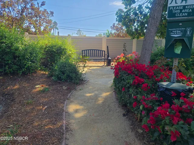 a bench sitting in middle of a yard