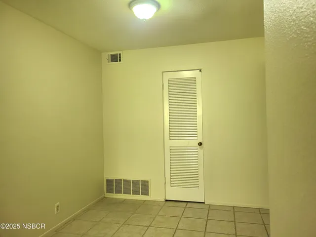 a kitchen with wooden cabinets and a stove top oven