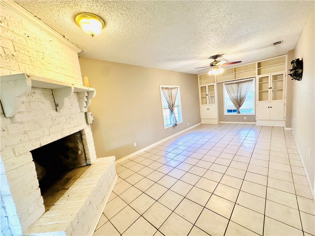 4725 Mable Street Corpus Christi, TX 78411 - Photo 16 of 21 a view of empty room with wooden floor and fan