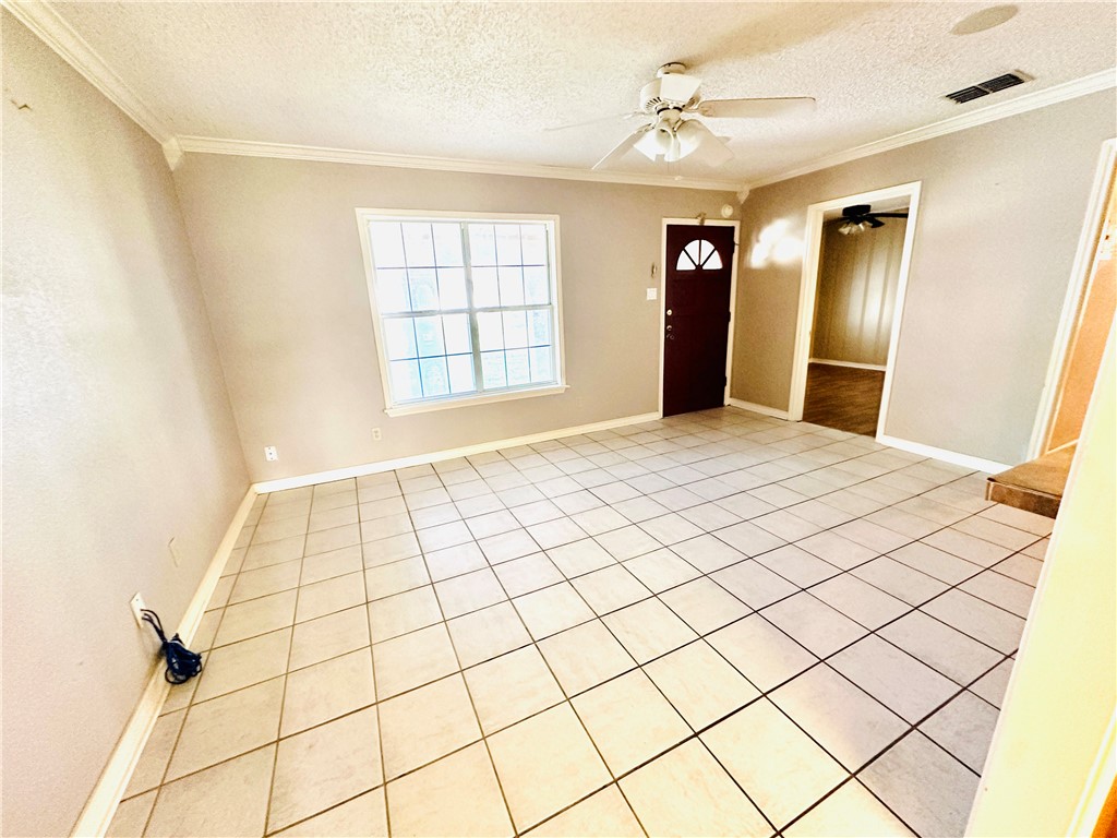4725 Mable Street Corpus Christi, TX 78411 - Photo 4 of 21 a view of an empty room with a window