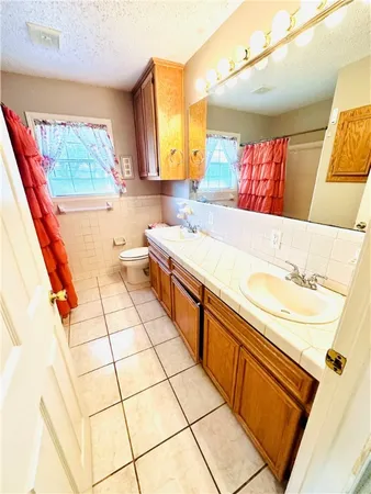 a bathroom with a sink a vanity and a mirror