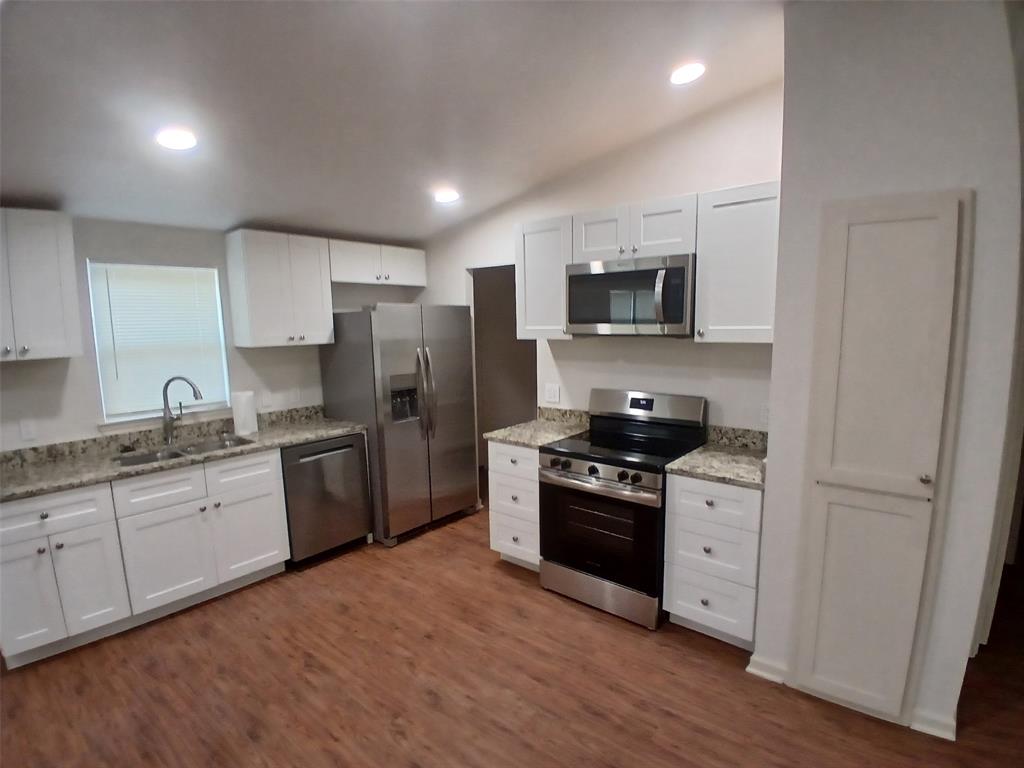 503 Windmere Circle Corinth, TX 76210 - Photo 2 of 20 Kitchen with new appliances, flooring, countertops, and recessed lighting