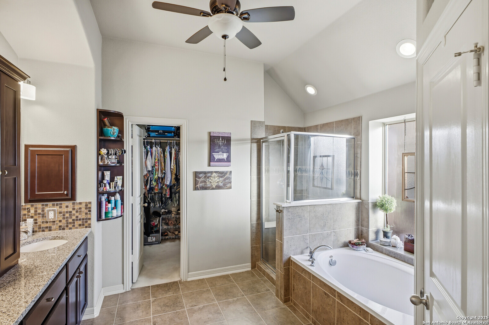 25523 River Ranch San Antonio, TX 78255 - Photo 11 of 45 a bathroom with a tub sink shower and mirror