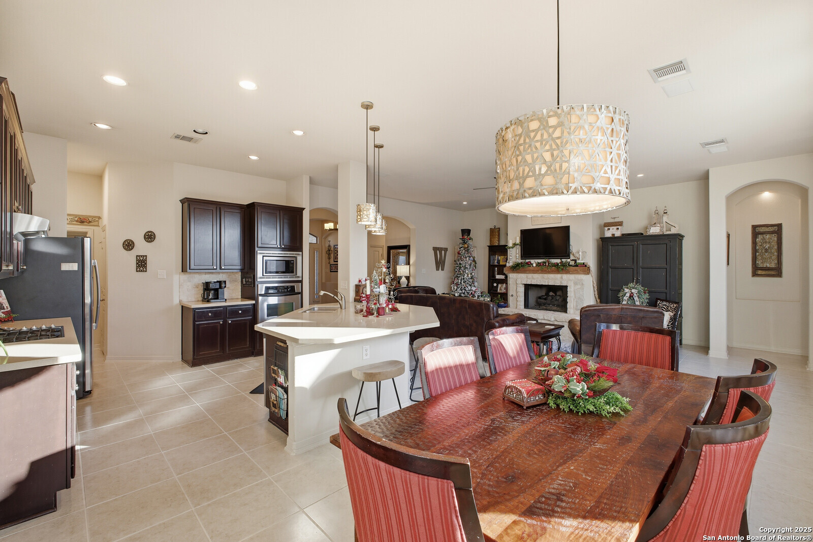 25523 River Ranch San Antonio, TX 78255 - Photo 13 of 45 a living room with fireplace furniture and a chandelier