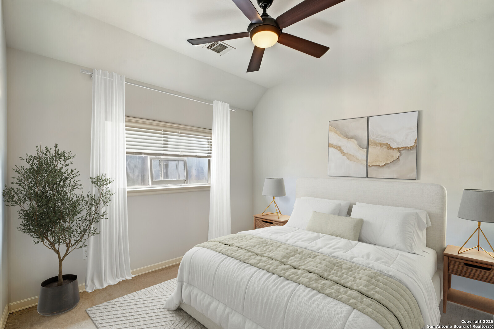 25523 River Ranch San Antonio, TX 78255 - Photo 16 of 41 a bedroom with a large bed and a potted plant