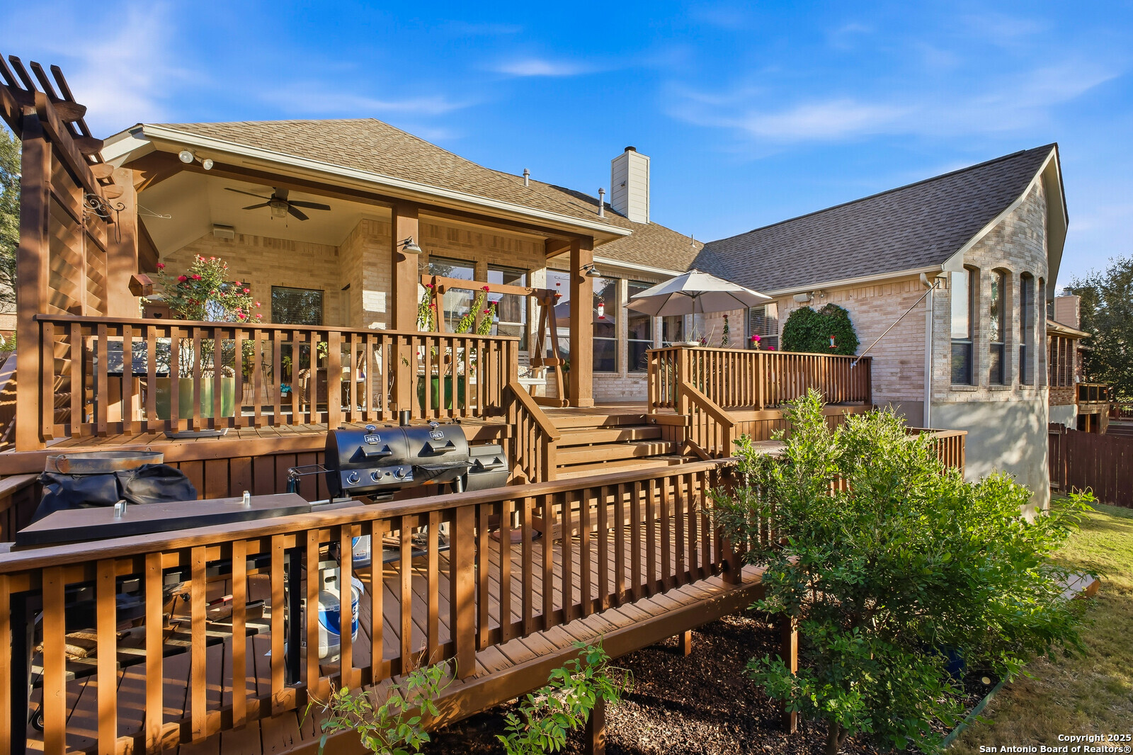 25523 River Ranch San Antonio, TX 78255 - Photo 22 of 41 a view of a brick house with large windows