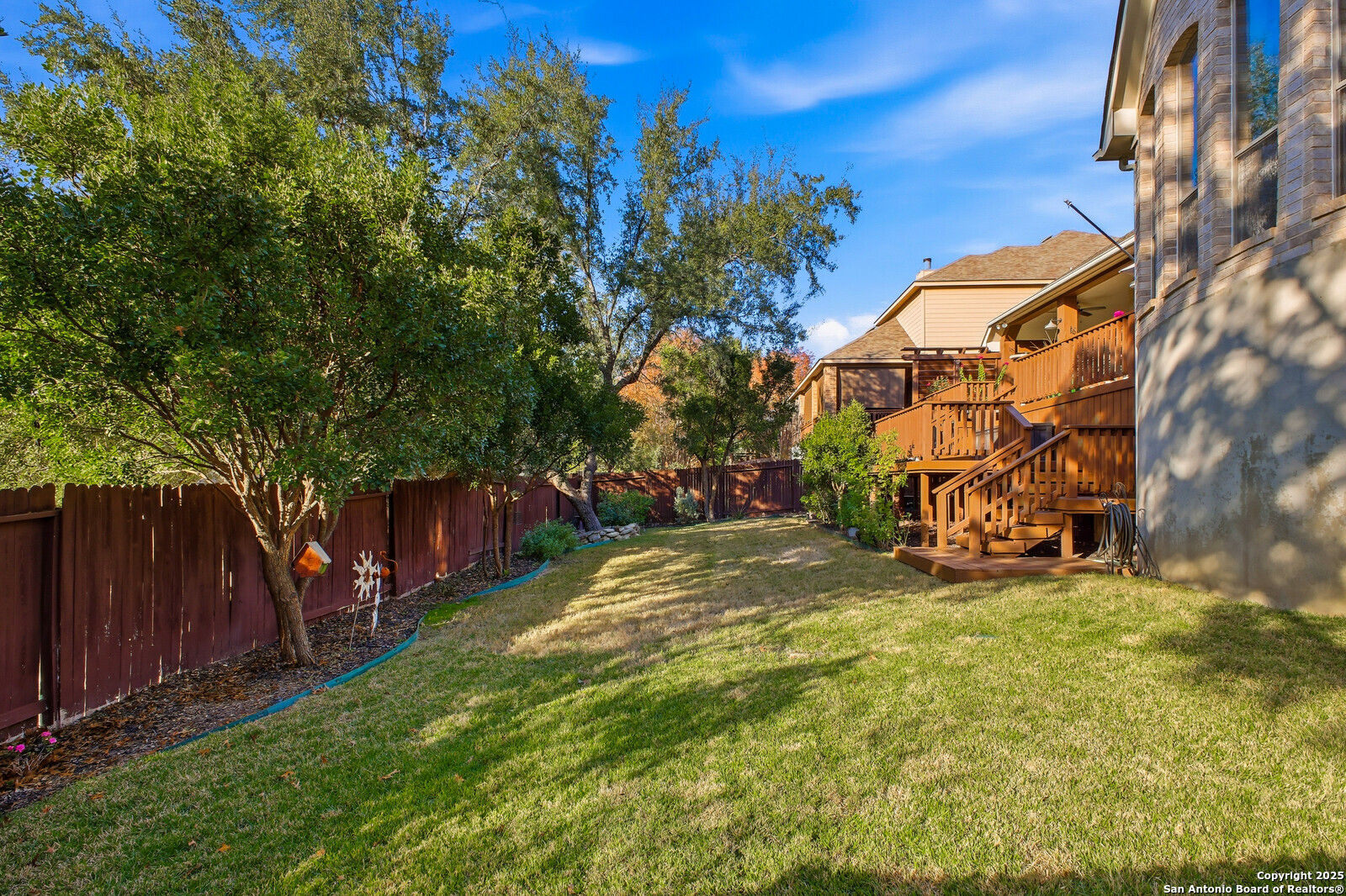 25523 River Ranch San Antonio, TX 78255 - Photo 25 of 41 a view of a backyard with a house