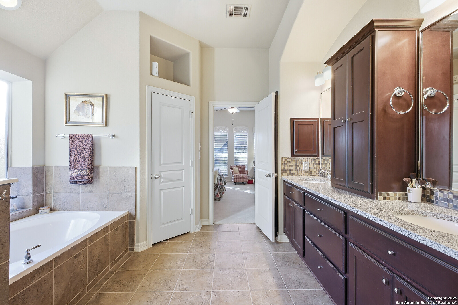 25523 River Ranch San Antonio, TX 78255 - Photo 30 of 41 a large bathroom with a granite countertop tub sink shower and mirror