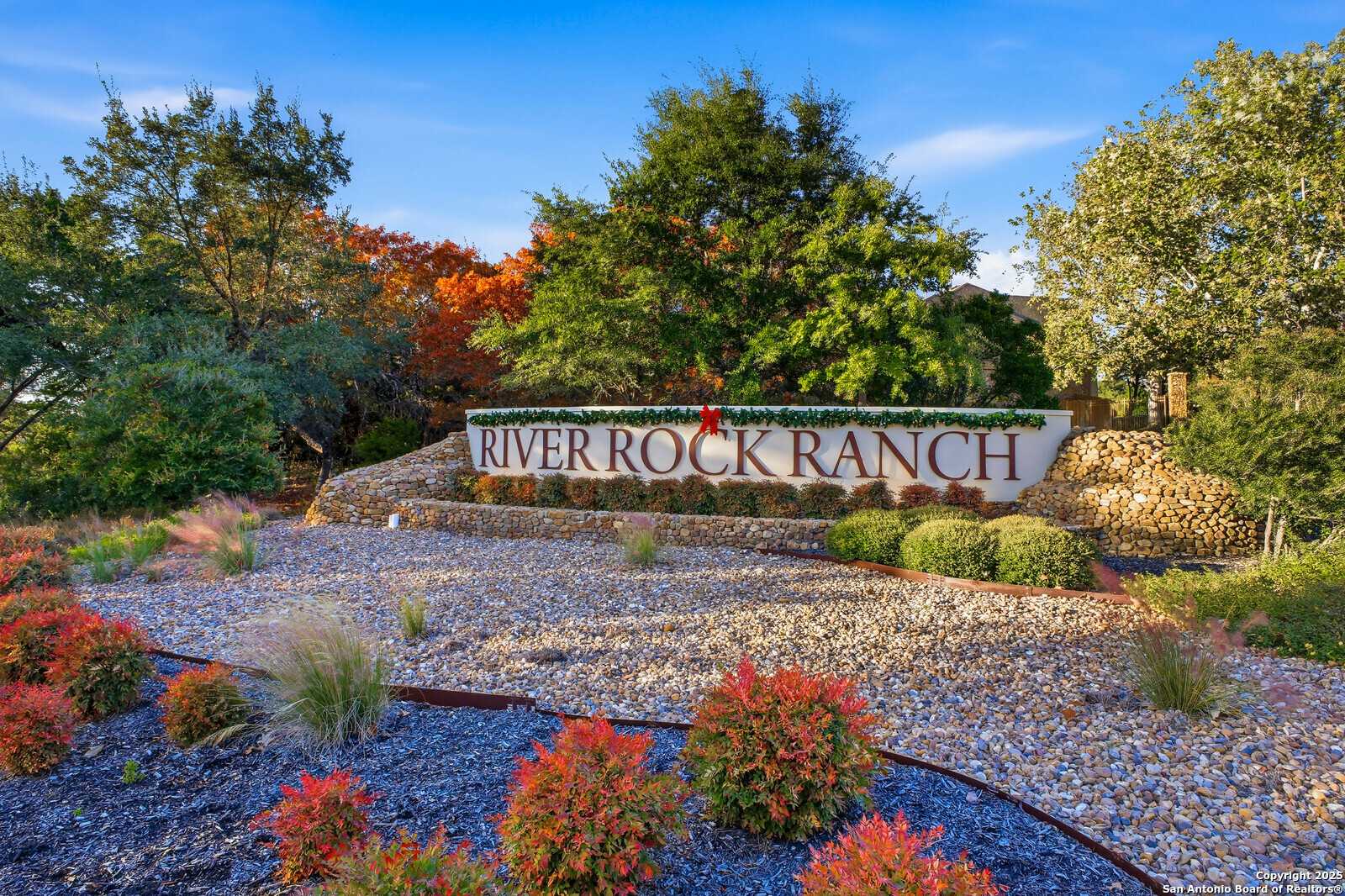 25523 River Ranch San Antonio, TX 78255 - Photo 33 of 41 a view of a sign board with flower plants