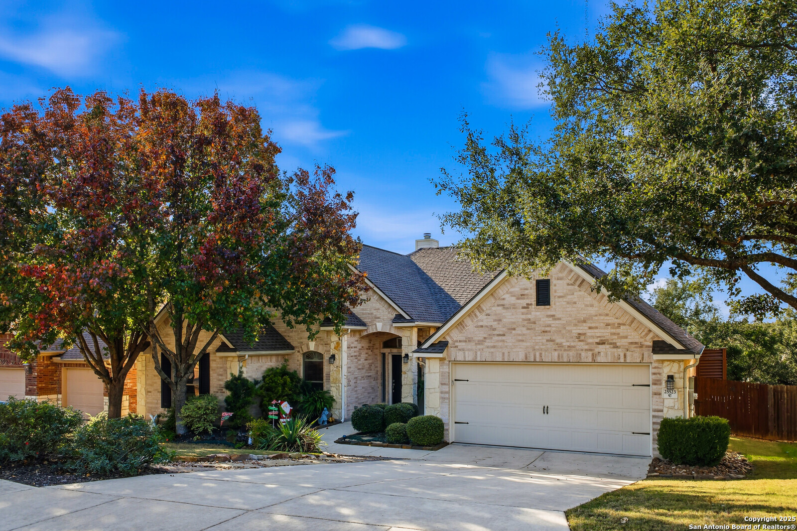 25523 River Ranch San Antonio, TX 78255 - Photo 45 of 45 a view of a white house with a tree and a yard