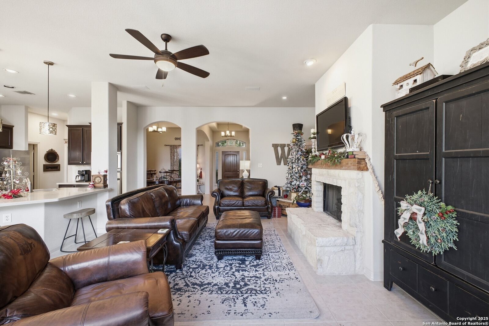 25523 River Ranch San Antonio, TX 78255 - Photo 6 of 45 a living room with furniture fireplace and a flat screen tv