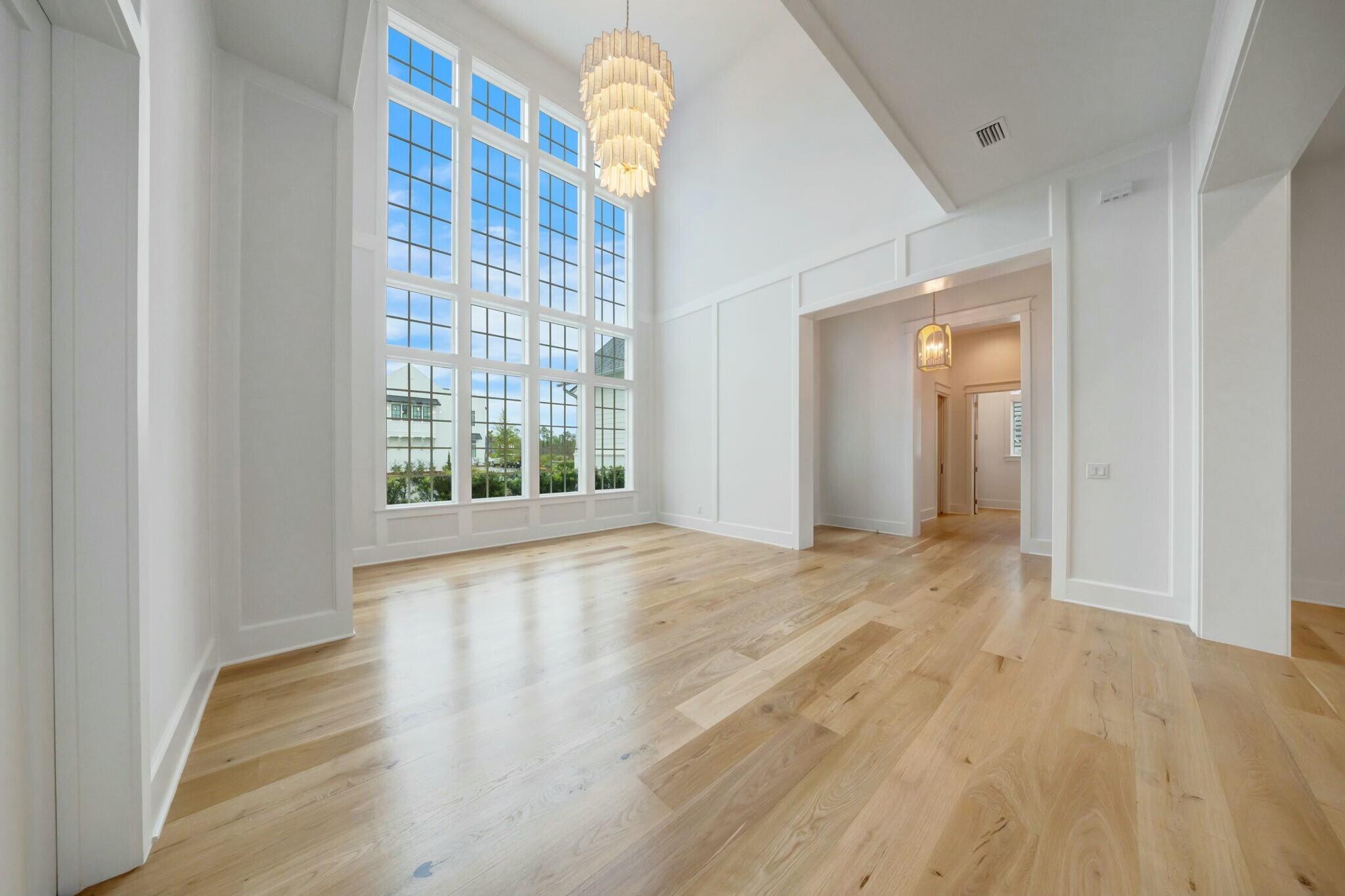 287 Golf Ridge Dr Inlet Beach Inlet Beach, FL 32461 - Photo 12 of 97 a view of an empty room with wooden floor and a window