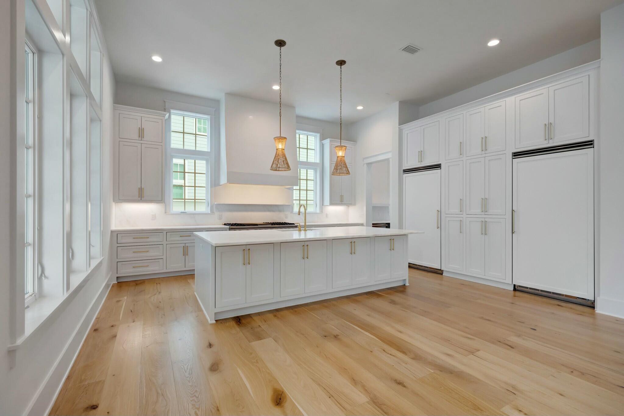 287 Golf Ridge Dr Inlet Beach Inlet Beach, FL 32461 - Photo 18 of 97 a kitchen with stainless steel appliances granite countertop a refrigerator a sink dishwasher a stove and white countertops with wooden floor