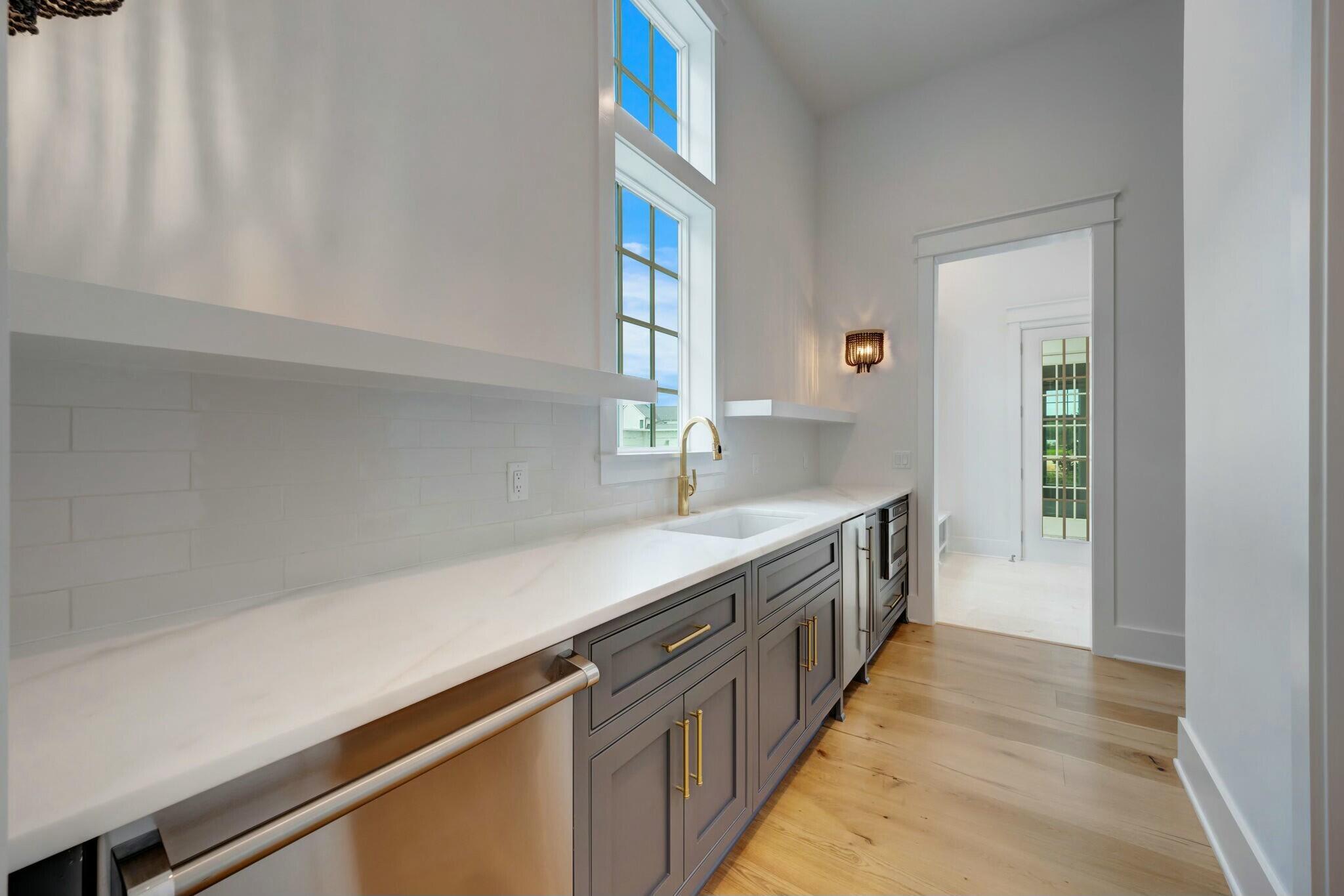 287 Golf Ridge Dr Inlet Beach Inlet Beach, FL 32461 - Photo 23 of 97 a kitchen with granite countertop a sink and a stove top oven