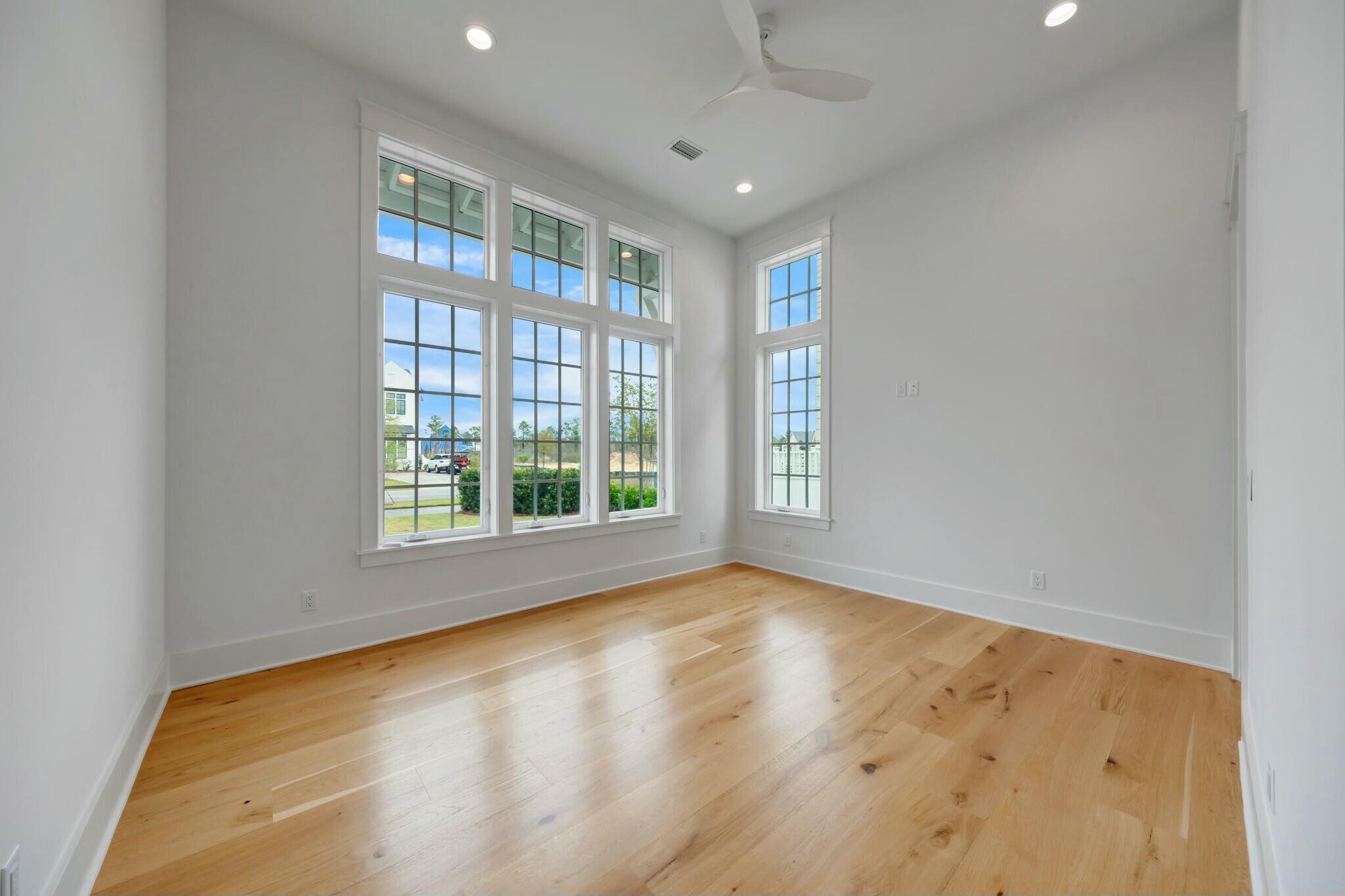 287 Golf Ridge Dr Inlet Beach Inlet Beach, FL 32461 - Photo 54 of 97 a view of empty room with wooden floor and fan