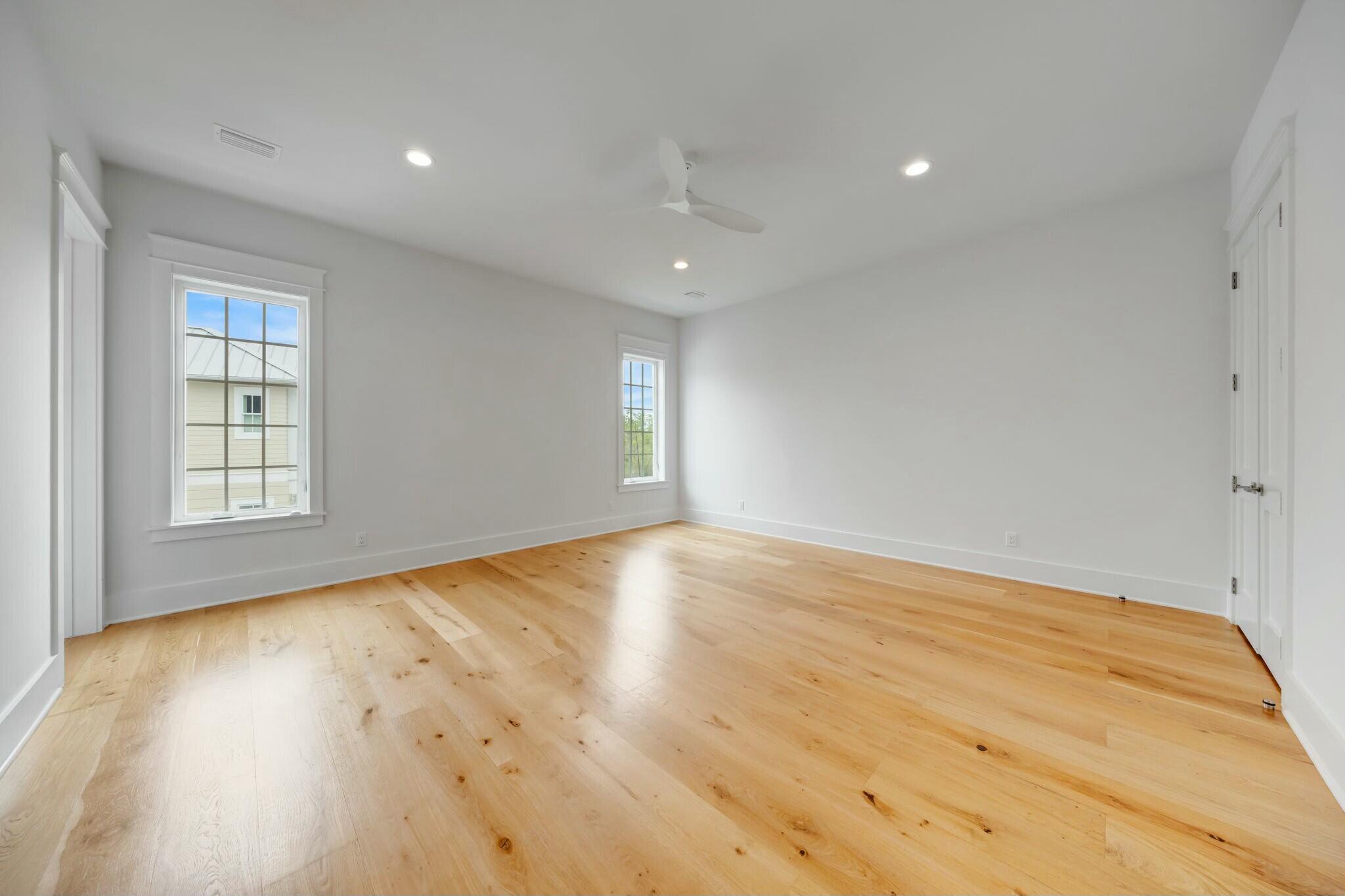 287 Golf Ridge Dr Inlet Beach Inlet Beach, FL 32461 - Photo 58 of 97 an empty room with wooden floor and windows