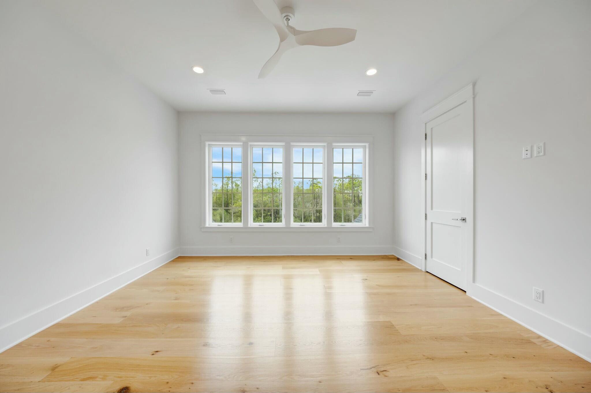 287 Golf Ridge Dr Inlet Beach Inlet Beach, FL 32461 - Photo 65 of 97 a view of an empty room with a window and wooden floor