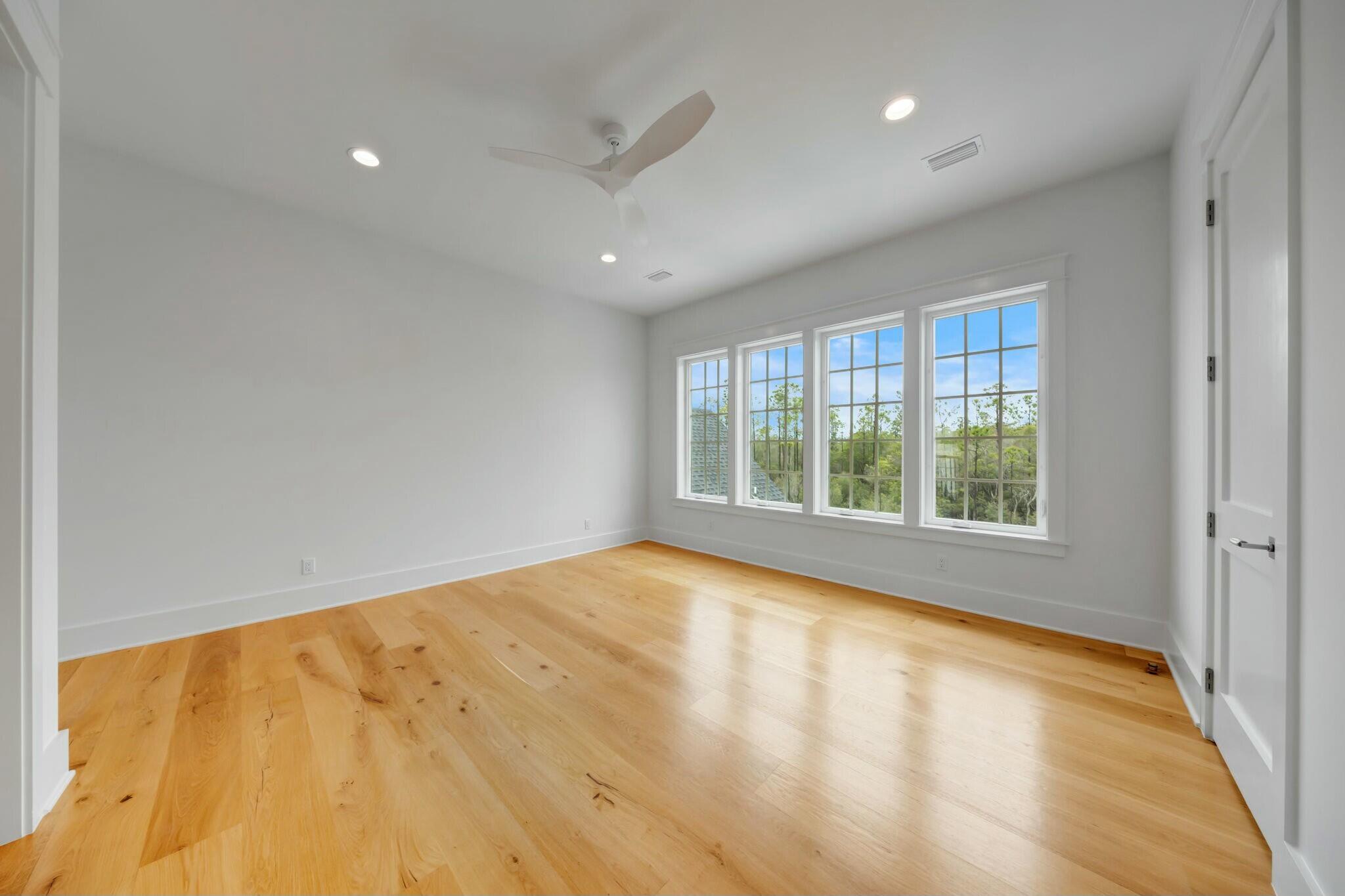 287 Golf Ridge Dr Inlet Beach Inlet Beach, FL 32461 - Photo 66 of 97 a view of an empty room with wooden floor and a window