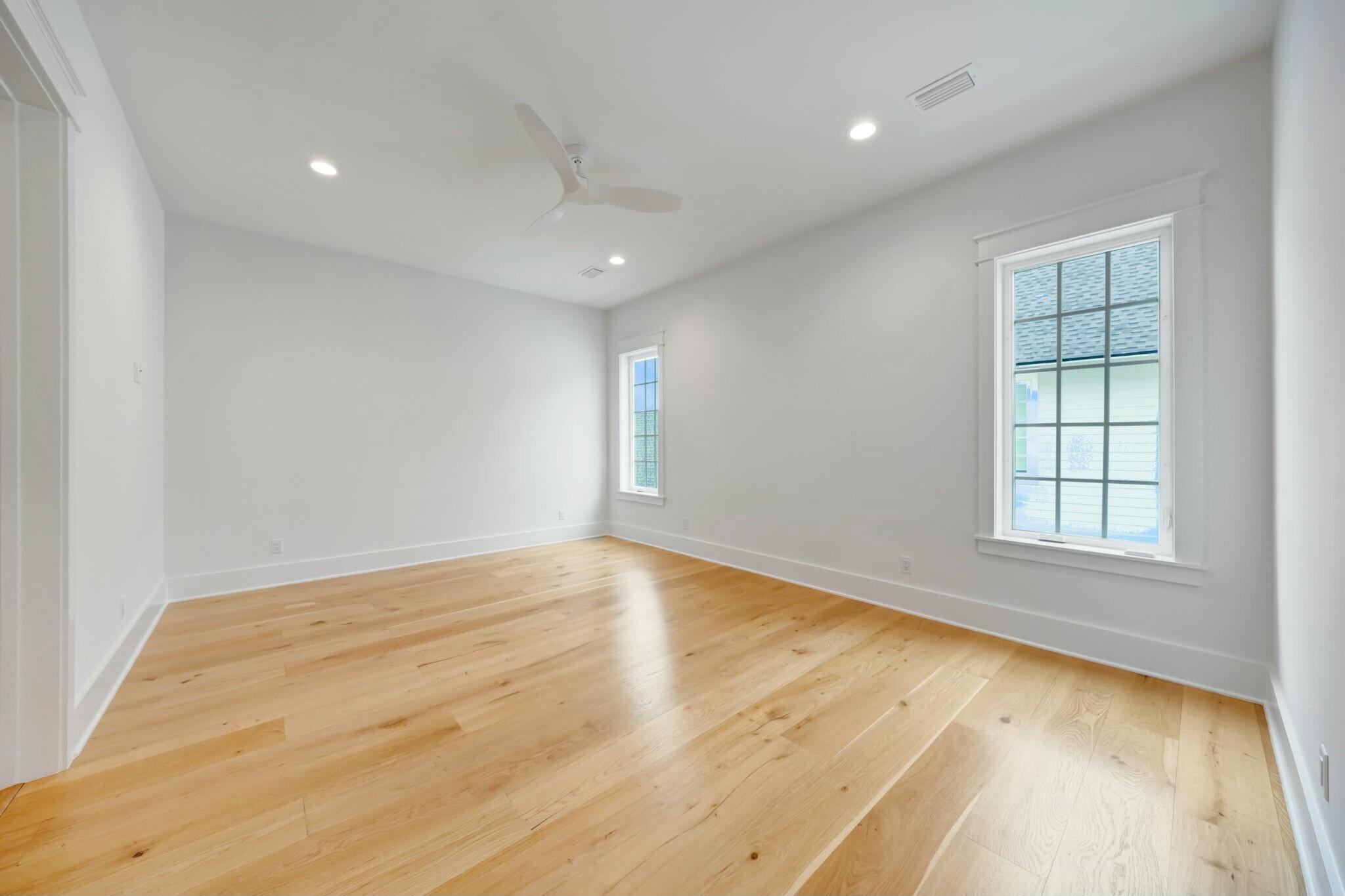 287 Golf Ridge Dr Inlet Beach Inlet Beach, FL 32461 - Photo 72 of 97 an empty room with wooden floor and windows