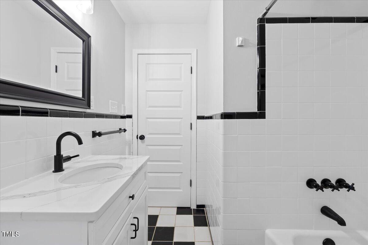 4312 James Road Raleigh, NC 27616 - Photo 29 of 44 a bathroom with a sink and mirror