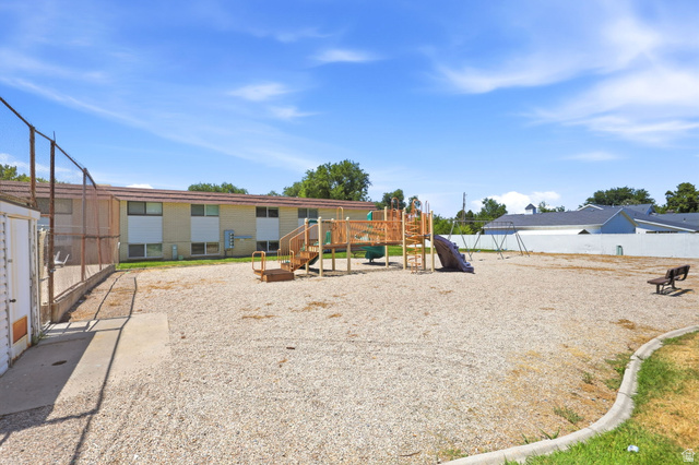 314 West Center Street, Unit F102 Bountiful, UT 84010 - Photo 22 of 29 Outdoor recreation area featuring a playground structure with slides and swings