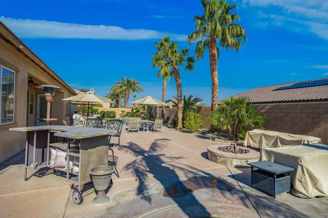 a view of a swimming pool with a yard