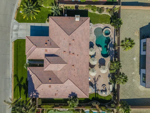 an aerial view of a house with a garden