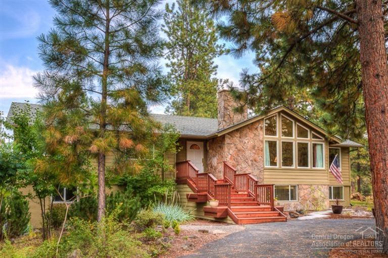 60192 West Ridgeview Drive Bend, OR 97702 - Photo 2 of 25 a front view of a house with a garden