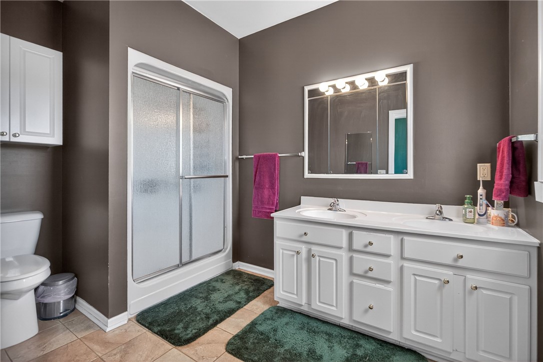 3400 Old Dobbins Bridge Road Fair Play, SC 29643 - Photo 14 of 50 This functional bathroom features a shower, dual vanity, and essential fixtures for daily routines.