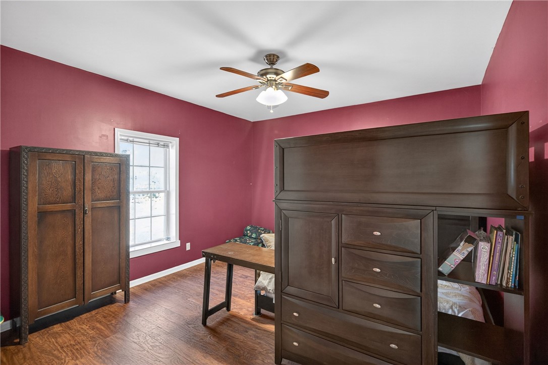 3400 Old Dobbins Bridge Road Fair Play, SC 29643 - Photo 15 of 50 This spacious bedroom features warm hardwood floors and a bright window, creating a welcoming retreat.